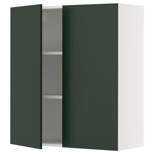A green SEKTION kitchen cabinet with an adjustable shelf and a door that stays open gently.