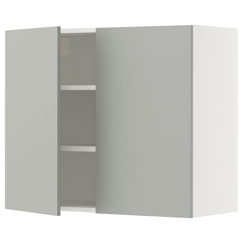 A modern light grey kitchen cabinet from the SEKTION system. It two doors and adjustable shelves.