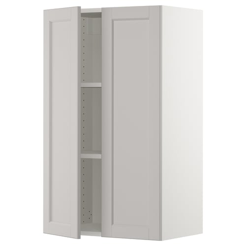 An off-white SEKTION wall cabinet with two open doors, revealing adjustable shelves inside.