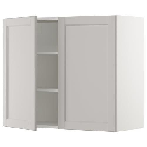A light grey SEKTION kitchen wall cabinet with a classic design, featuring two doors and an adjustable shelf.