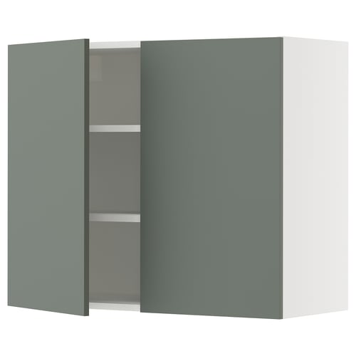 A modern grey-green cabinet with two doors from IKEAs SEKTION kitchen system. It has a sleek, square shape with adjustable shelves inside.