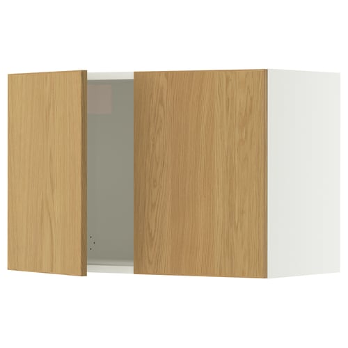 A SEKTION kitchen cabinet with wooden doors. One door is open revealing the inside. The cabinet is light-colored with solid oak trim.