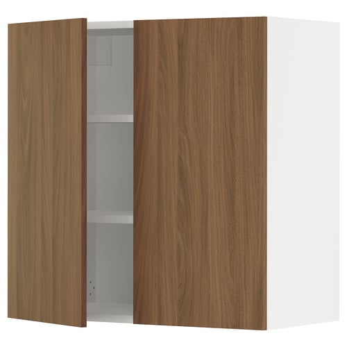 Brown wood grain kitchen cabinet open displaying shelves.