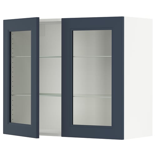 SEKTION kitchen cabinet with blue glass doors and shelves.