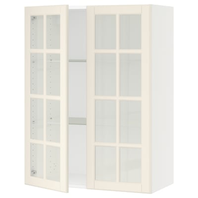 A white SEKTION kitchen unit with glass doors. It has a traditional design, featuring bevelled edges on the glass doors and adjustable shelves.