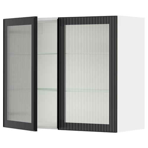 Modern kitchen cabinet with black framed glass door featuring vertical lines and sleek metal handle.