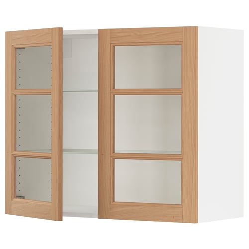 SEKTION kitchen unit with oak doors and glass shelves.