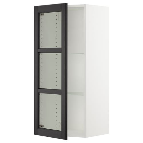 An open white SEKTION kitchen cabinet with black-stained glass doors featuring bevelled edges. The cabinet has adjustable shelves.