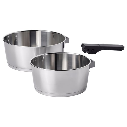 Two stainless steel SLÄTROCKA saucepans with detachable black handles. Designed for efficient cooking and easy storage.