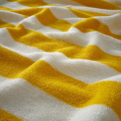 Bright yellow and white striped towel with pink edges, folded.