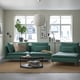 Modern living room with teal SÖDERHAMN sofa and armchair, cosy & stylish, deep seats by large windows.