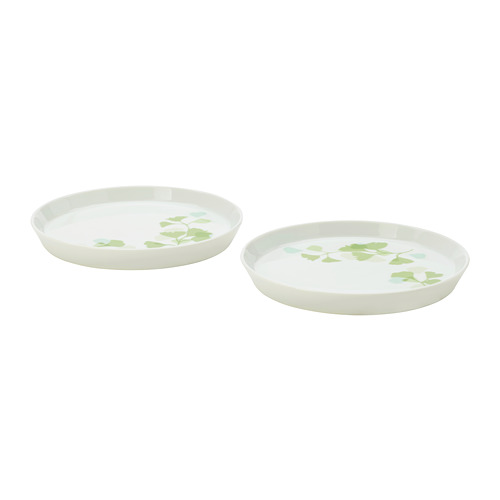 Two white porcelain plates with green leaves design, suitable for serving food, durable and stackable for easy storage.