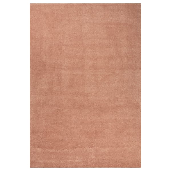 A neutral-colored rectangular rug named STOENSE, made of polypropylene and rubber, ideal for bedrooms.