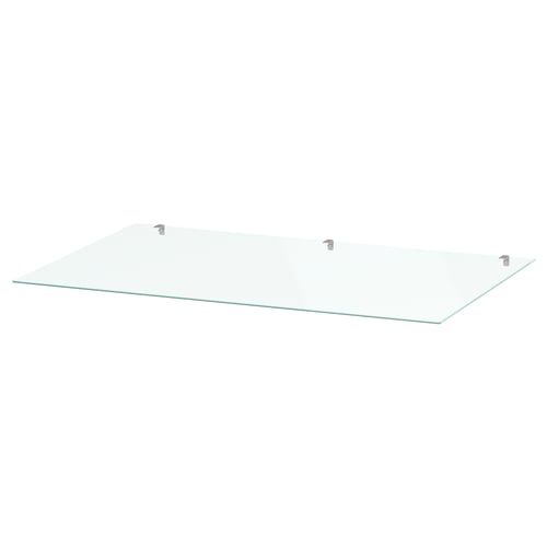 A clear glass shelf called STORKLINTA, designed to protect and enhance furniture surfaces.