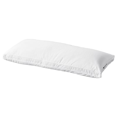 A white IKEA STRANDMOLKE pillow. It a supportive core and fluffy outer filling, with double piping and a dobby woven cotton cover.