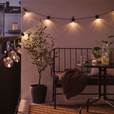 SVARTRÅ LED string light with 12 lights, outdoor black