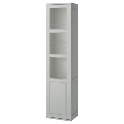 TÄNNFORSEN light grey tall cabinet with glass door. Slim, rectangular design with bevelled panels and vertical storage.