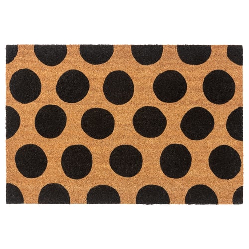Black-and-tan polka dot doormat, rectangular, made of coir with jute backing.