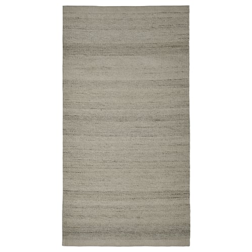 Flatwoven grey rug, rectangular shape, subtle striped design, made of cotton and wool.