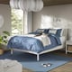 TONSTAD bed in off-white with blue geometric comforter and pillows, creating a classic design with low profile.