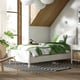 TONSTAD off-white bed with drawers and white headboard; wooden floor, striped rug, green bedding, large window, modern decor.