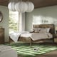 Modern bedroom with TONSTAD bed, green rug, large headboard.