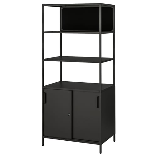 Black metal TROTTEN shelf unit with enclosed cabinet at base, three open shelves above. Modern, minimalist design.