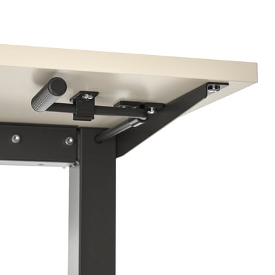Close-up of desks height adjustment mechanism with crank handle.