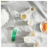 UPPFYLLD Measuring spoon, set of 2, off-white/bright green