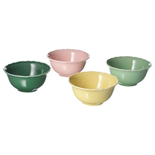 Four colourful bowls in green, pink, yellow arranged in a square, made from feldspar porcelain.