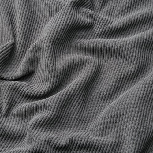 Close-up of textured, wide-wale corduroy fabric, showing soft, comfy material with subtle sheen.