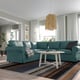 Cosy living room with UPPLAND teal sectional sofa, large windows, striped rug, and modern pendant lamp.