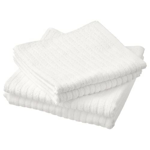 Stack of four white VÅGSJÖN cotton towels, soft, absorbent terry.