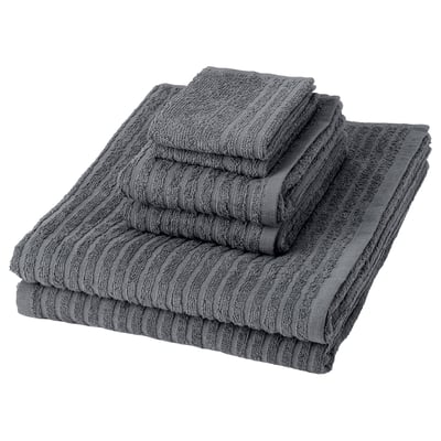 Six grey cotton towels stacked neatly, featuring a textured, striped pattern.
