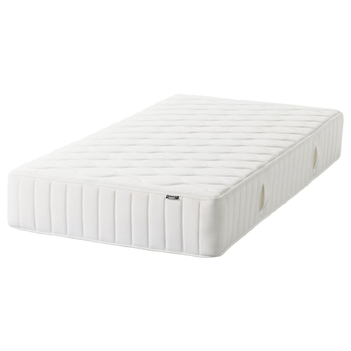 White VÅGSTRANDA double layer spring mattress, firm, quilted white cover.