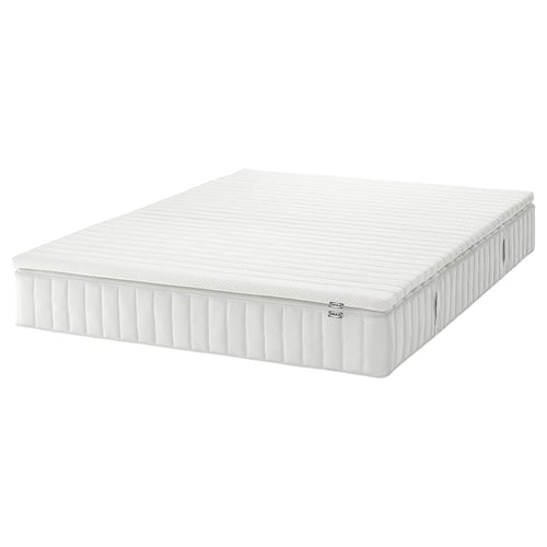 A white VALEVÅG pocket spring mattress with a quilted top, providing a firm yet supportive sleep surface.