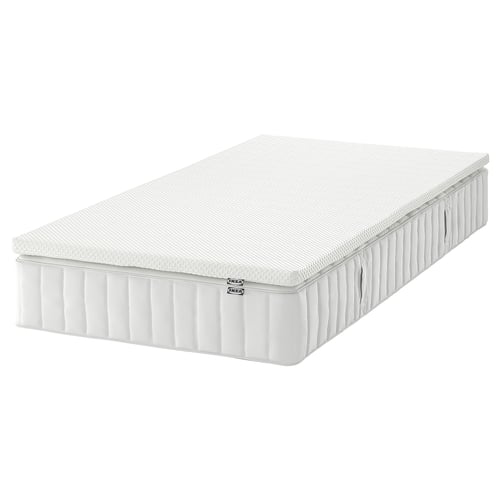 This is a white IKEA VALEVÅG pocket-spring mattress, rolled and rectangular, with memory foam layers for comfort and support.