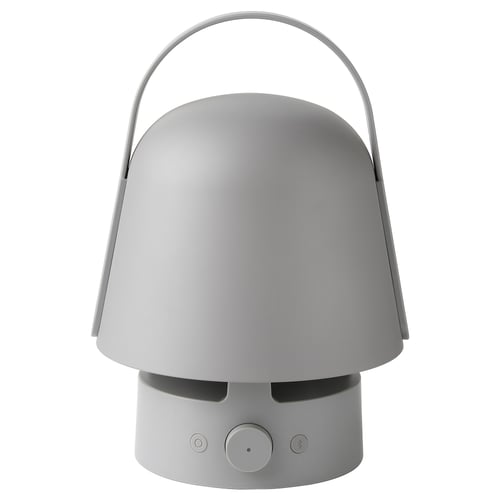 A VAPPEBY speaker lamp. Its grey, cylindrical with a handle, and combines a speaker and a lamp.