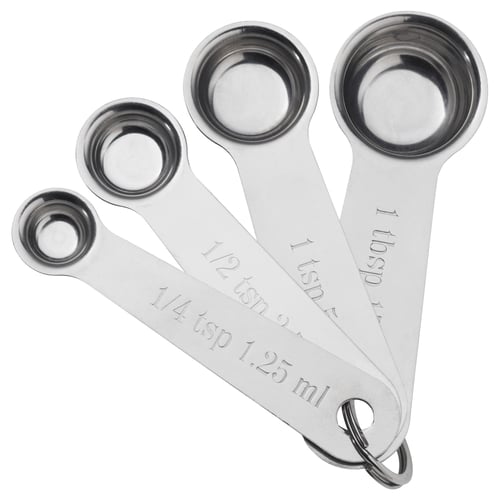 Four stainless steel measuring spoons, nested for compact storage, with sizes clearly engraved on each spoon.