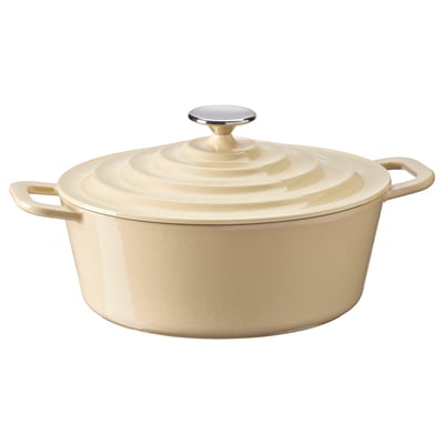 A beige enamelled cast iron pot with two side handles and a lid, ideal for cooking and baking.