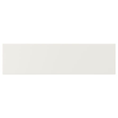 A white VEDDINGE kitchen cabinet. Its rectangular, smooth, and lacquered.