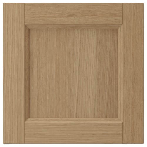Natural wood VEDHAMN cabinet door, square with simple panel design, light brown oak finish.