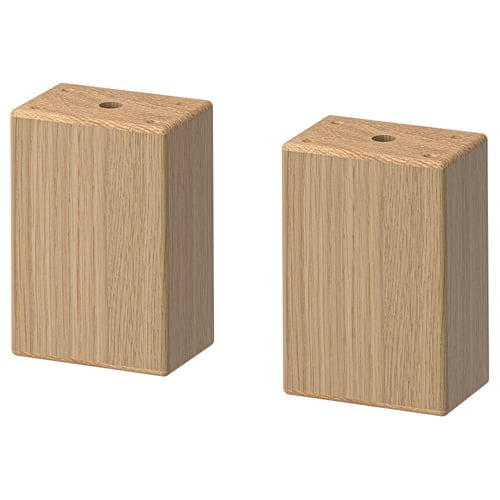 Two light brown oak wooden blocks, rectangular with smooth edges, standing upright side by side.