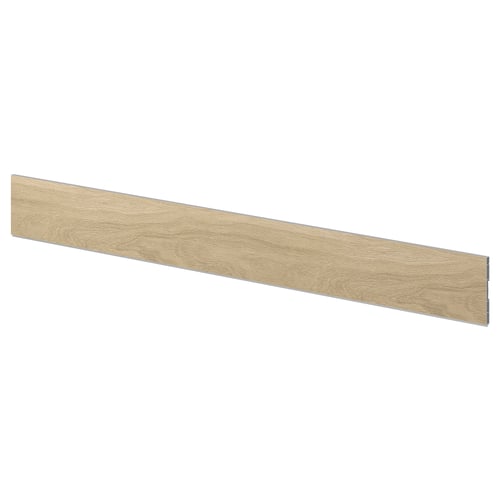 A VEDHAMN oak kitchen plinth. Its beige, rectangular, and has a wooden texture.