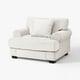 Light grey, upholstered chair; soft, rolled arms; plush cushion; modern traditional design.