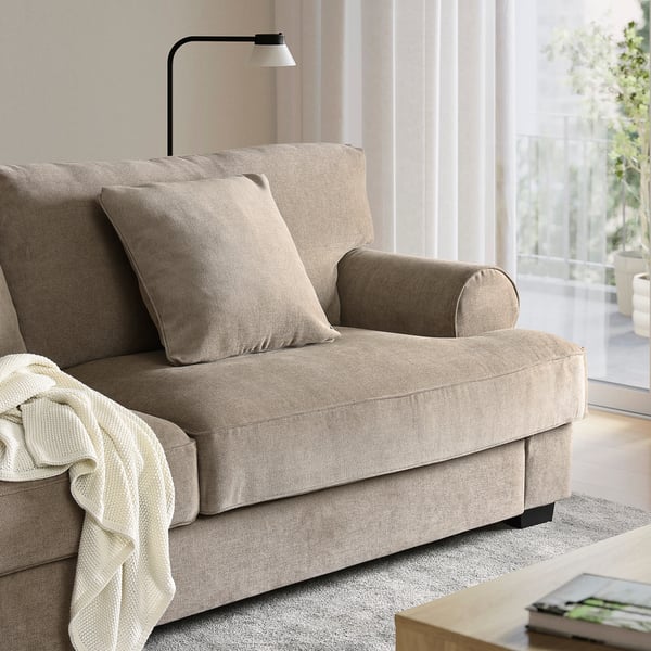 Modern beige VENNGARN loveseat. Compact, cosy with neutral throw pillows.