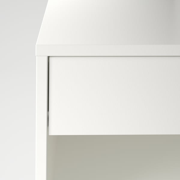 Modern white cabinet with smooth, soft-close drawer. High-quality design for silent use.