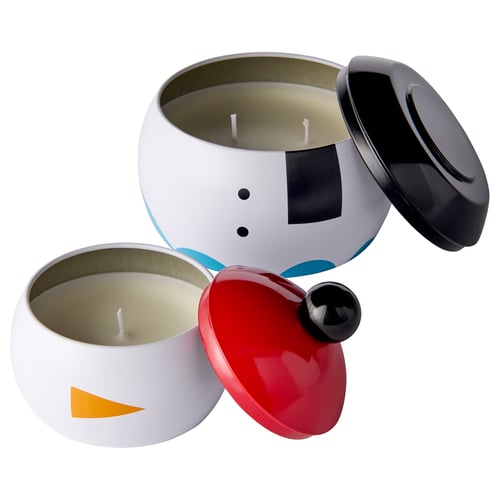 Colourful snowman candles, plant wax, lids off, white background.