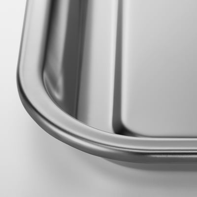 Close-up of sleek, stainless steel baking sheet, showcasing its smooth, durable surface.