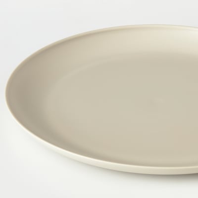 Flat, cream-colored dinner plate. Simple and elegant design.